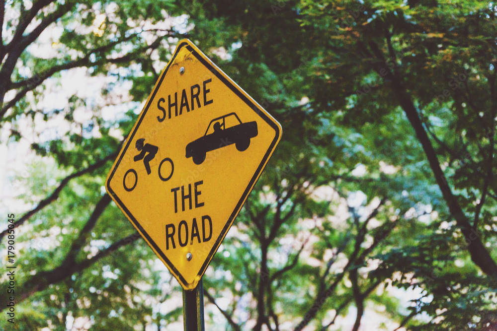 Share the road sign with greenery