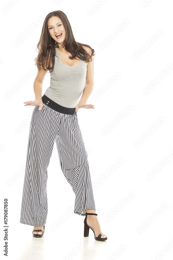 beautiful young woman in summer clothes and high heels on white background beautiful young woman in summer clothes and high heels on white background