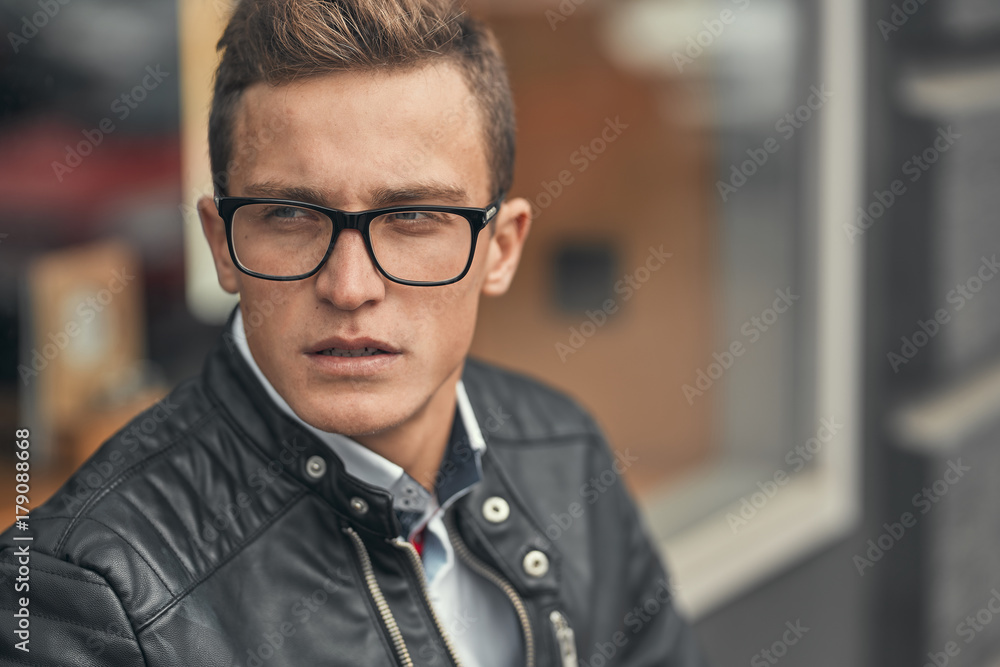 A charismatic guy looks at the camera A charismatic guy looks at the camera