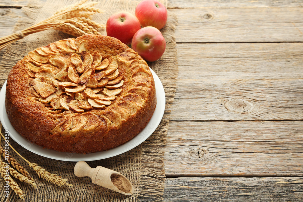 Apple cake in plate on grey wooden table Apple cake in plate on grey wooden table