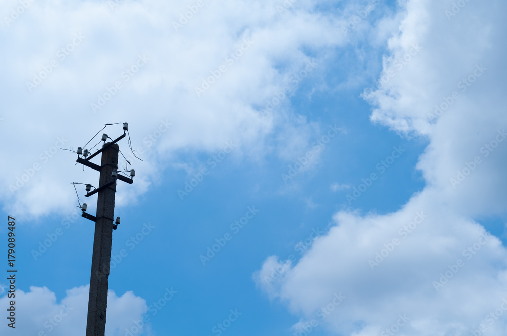 Old pillar and broken power line in sky background Old pillar and broken power line in sky background