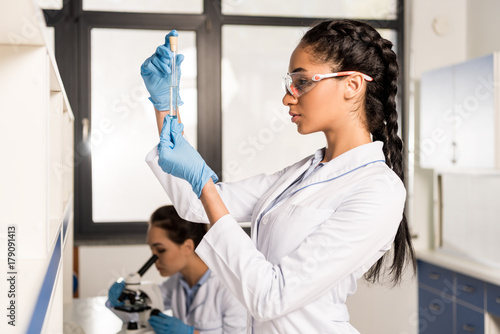 Young scientist in laboratory photo