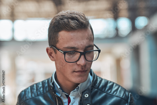 Stylish guy straightens the collar