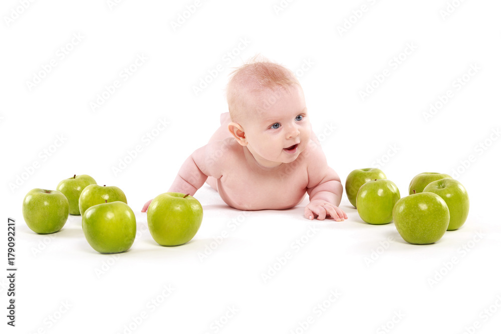 little boy surrounded by green apples little boy surrounded by green apples
