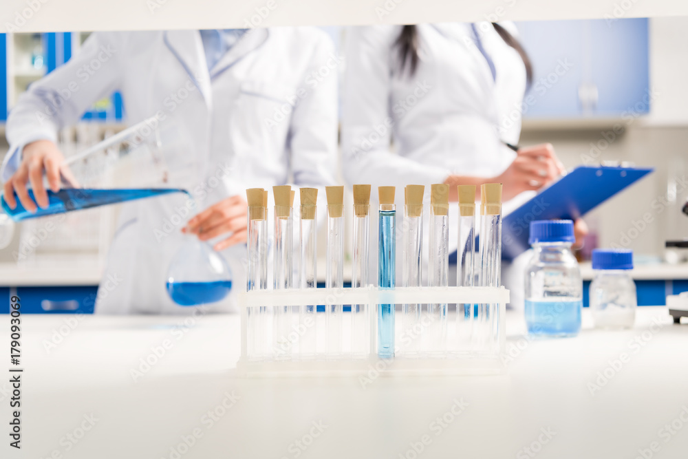 Scientists working with reagents Scientists working with reagents