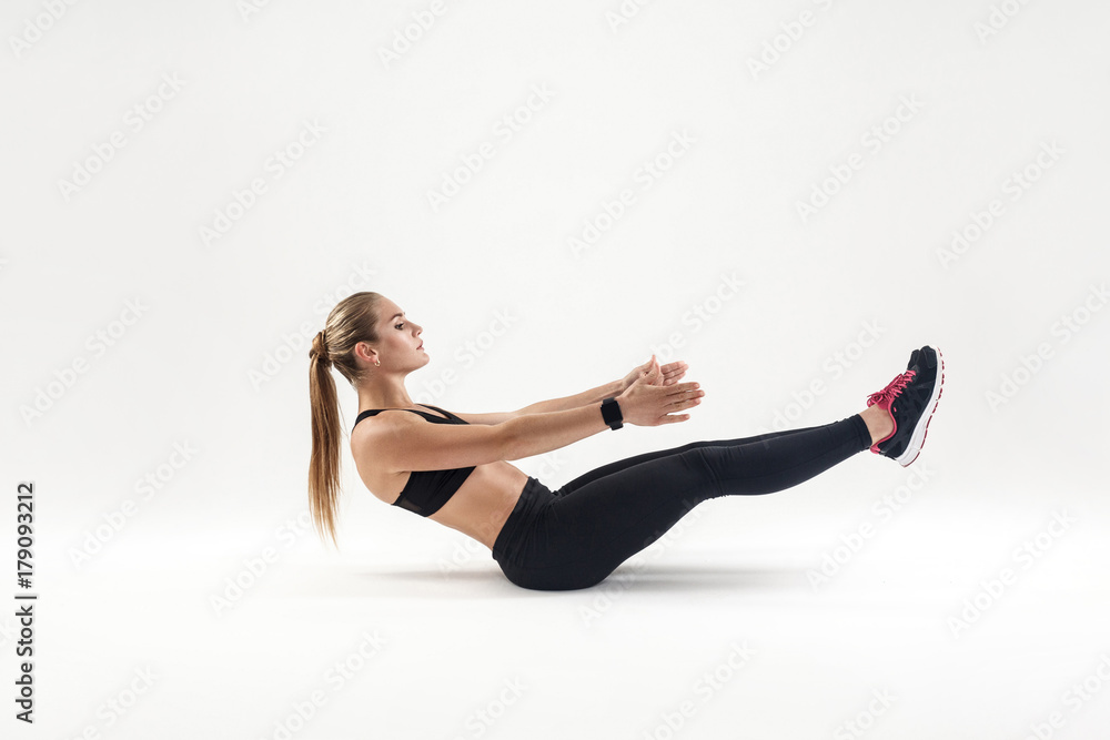 Woman in sportswear doing pilates exercising