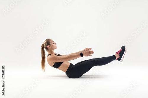 Fototapeta Naklejka Na Ścianę i Meble -  Woman in sportswear doing pilates exercising