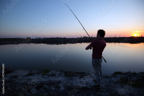 Wallpaper Mural Men fishing in sunset and relaxing while enjoying hobby Torontodigital.ca