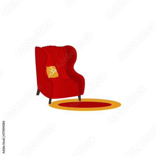 vector cartoon stylized red comfortable armchair with warm woolen blanket or rug and orange pillow. Isolated illustration on a white background. Cozy demestic interior design element photo