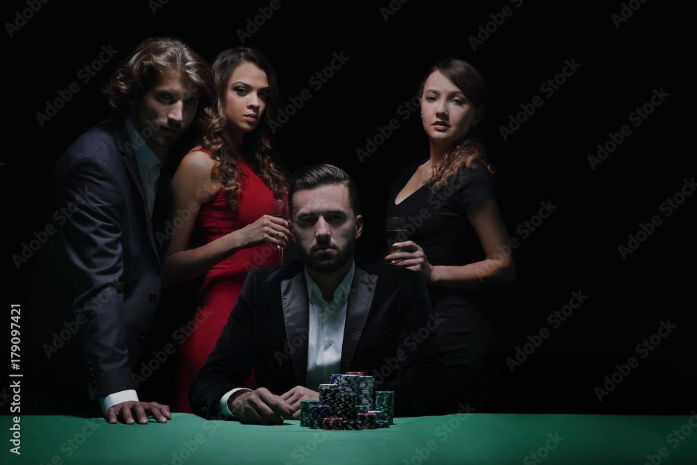 Attractive young caucasian man make bet in the casino Attractive young caucasian man make bet in the casino