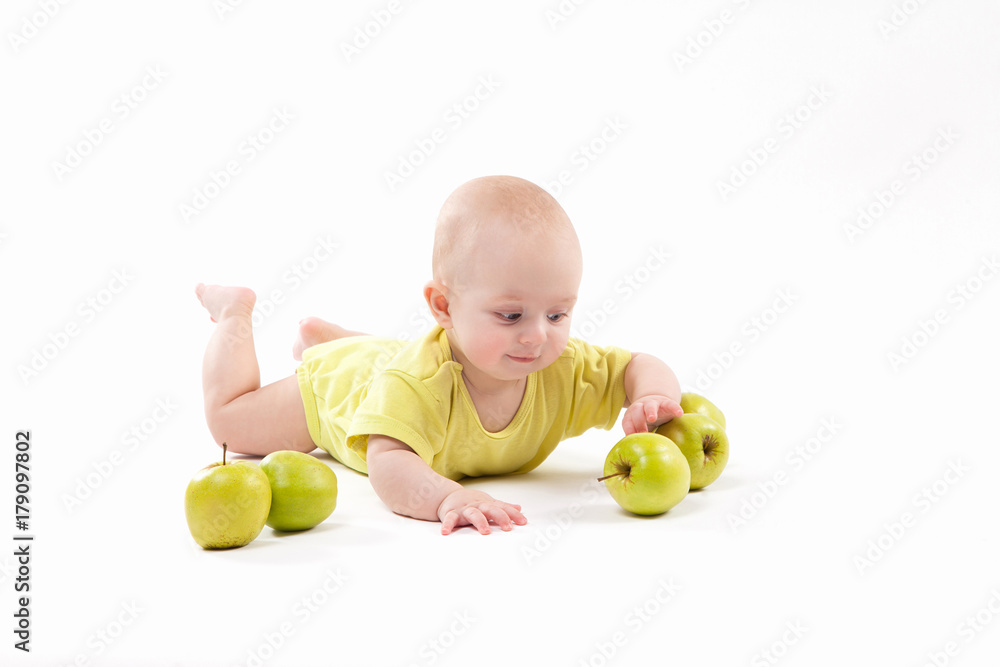 smiling baby lying on the background to include apples smiling baby lying on the background to include apples