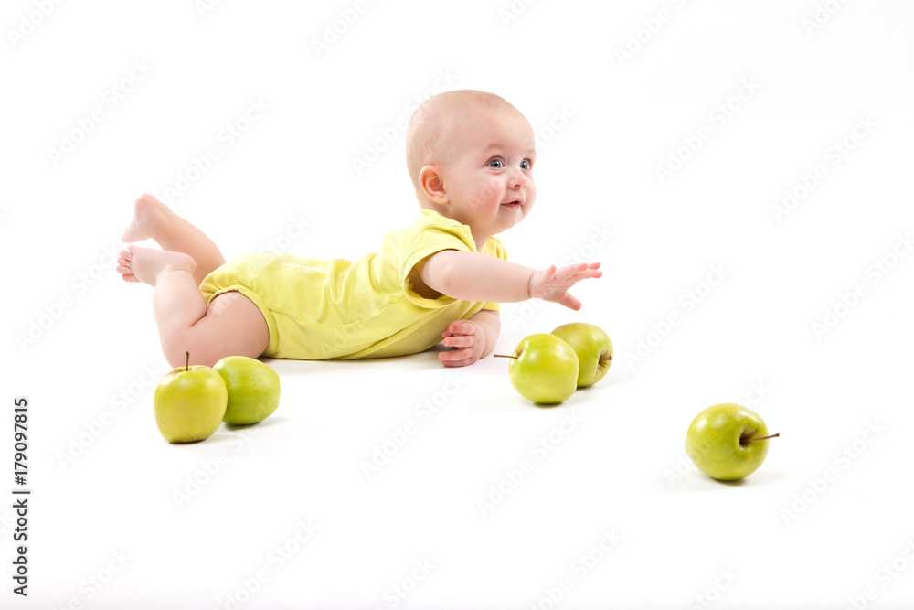 smiling baby lying on the background to include apples smiling baby lying on the background to include apples