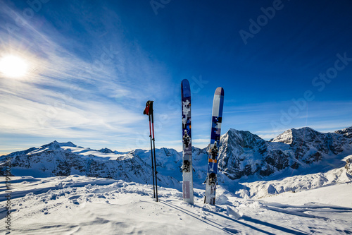 Ski in winter season, mountains and ski touring backcountry equipments on the top of snowy mountains in sunny day. South Tirol, Solda in Italy. © Gorilla