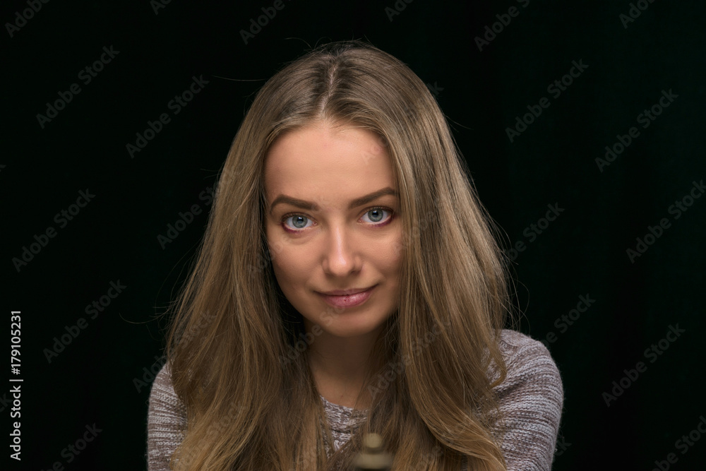 portrait of a beautiful girl on a black background. portrait of a beautiful girl on a black background.