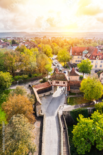 Europe culture concept - panoramic city skyline birds eye aerial view under dramatic sun and morning blue cloudy sky in Rothenburg, Germany