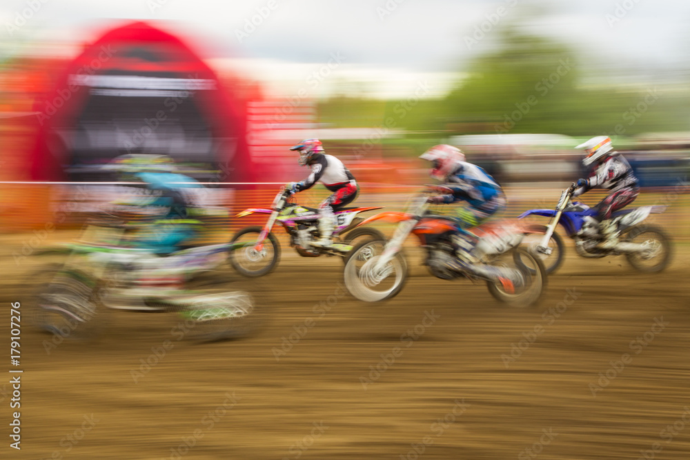 Motocross competition bike rider in motion