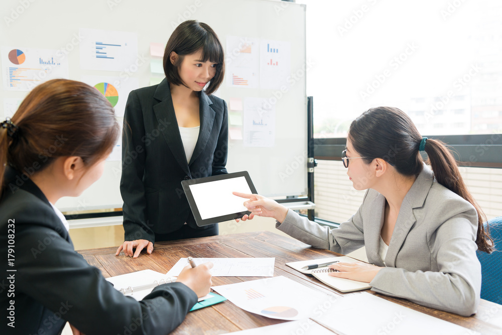 female office worker using mobile digital tablet female office worker using mobile digital tablet