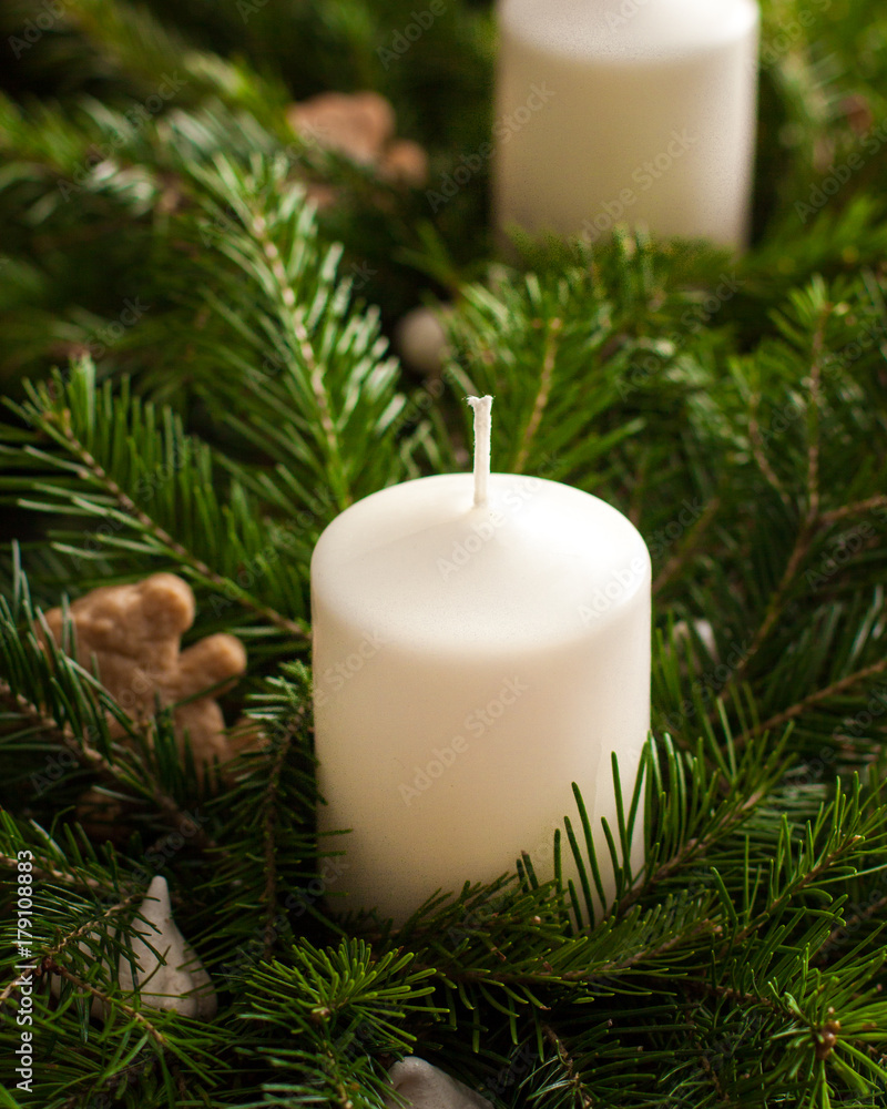Christmas card. White candles in a green Christmas tree on background festive decoration. Christmas table decoration. Homemade gifts Christmas card. White candles in a green Christmas tree on background festive decoration. Christmas table decoration. Homemade gifts