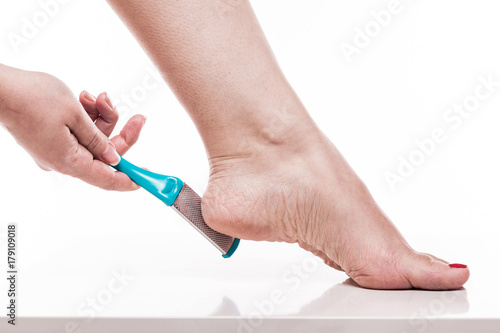 care for dry skin on the well-groomed feet and heels with the help of tools pedicure graters Foot