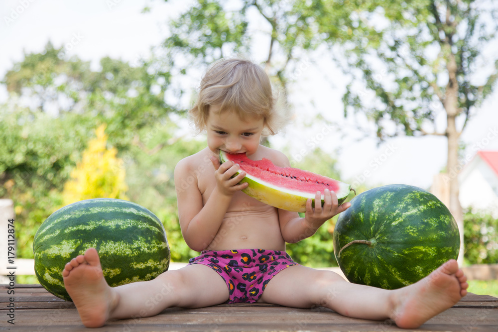 Fototapeta premium Funny little girl with watermelon slice