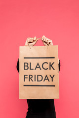 woman holding shopping bag