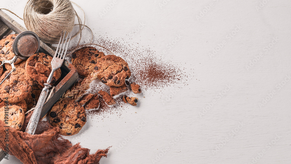 Cookies with chocolate. On a wooden background. Top view. Free space for your text.