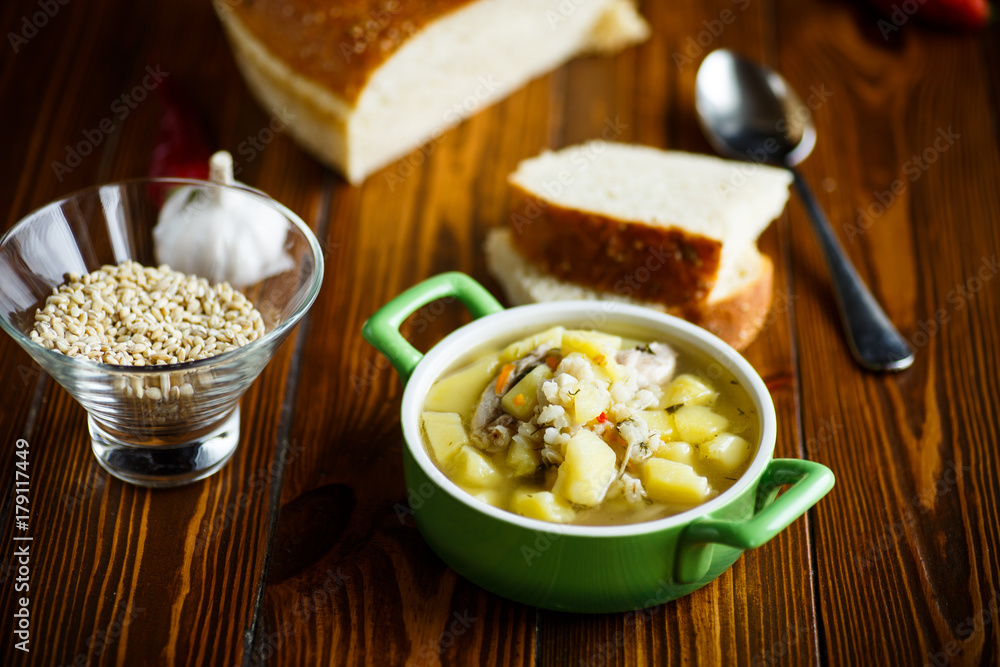 chicken soup with pearl barley in a bowl chicken soup with pearl barley in a bowl