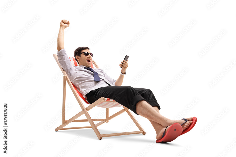 Businessman looking at a phone and gesturing happiness Businessman looking at a phone and gesturing happiness