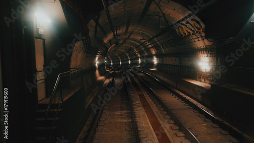 Photography View of subway tunnel as seen from reverse of moving backward train