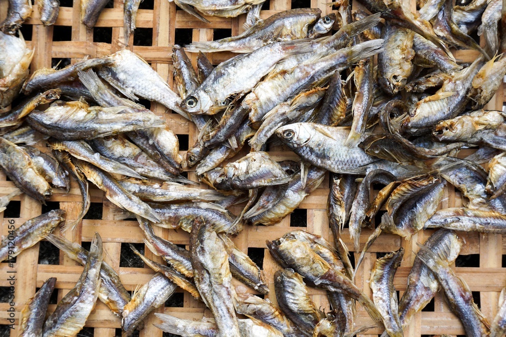 dry salty Minnow fish on bamboo basket