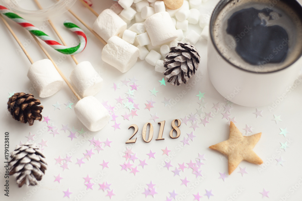 Christmas candy bar with cookies, marshmallow and coffee. New Year's Day dessert and holiday decoration. A cup of coffee.