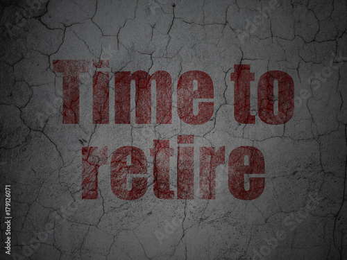 Time concept: Red Time To Retire on grunge textured concrete wall background