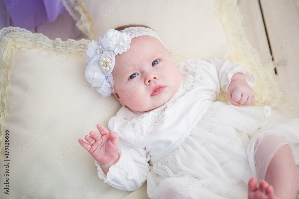 Little baby girl in a beautiful dress Little baby girl in a beautiful dress