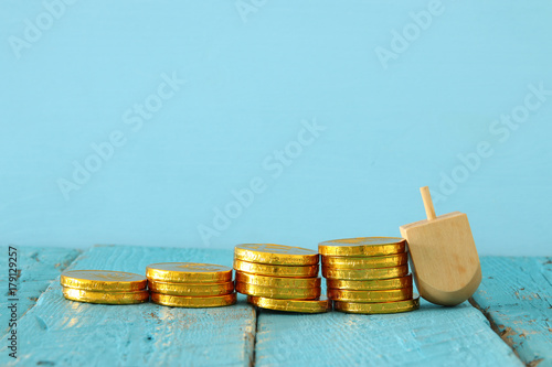 jewish holiday Hanukkah image background with traditional spinnig top and chocolate coins photo