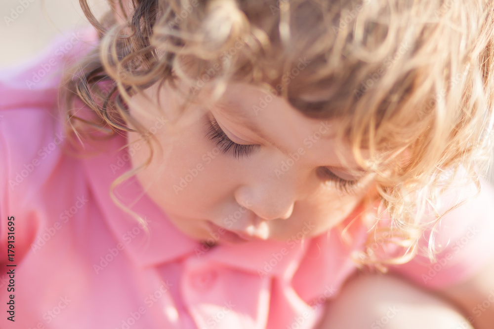 Closeup portrait of toddler curl hair blonde girl Closeup portrait of toddler curl hair blonde girl