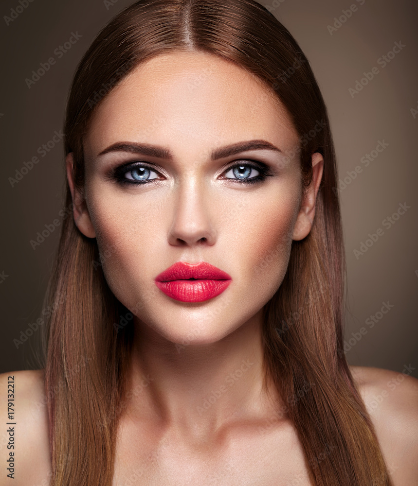 Portrait of beautiful girl model with evening makeup and romantic hairstyle. Pink lips Portrait of beautiful girl model with evening makeup and romantic hairstyle. Pink lips