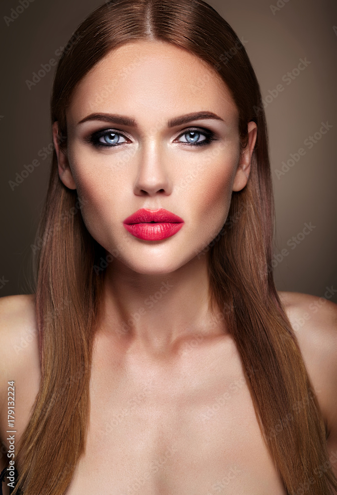 Portrait of beautiful girl model with evening makeup and romantic hairstyle. Pink lips Portrait of beautiful girl model with evening makeup and romantic hairstyle. Pink lips