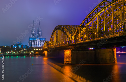 Night view of Hohenzollern Bridge and the cathedral in Cologne, Germany