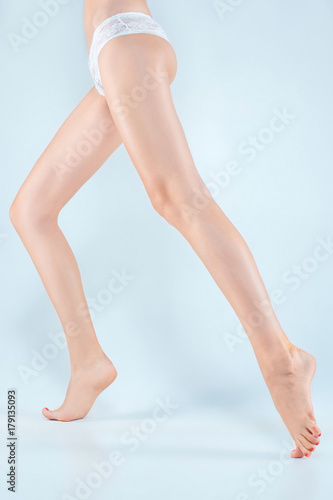Perfect female legs in underwear.