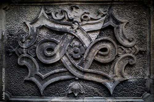 Ornaments, moldings, gargoyle, low reliefs in a sandstone, granite, concrete. sculpting details in Gdansk (Danzig).  Mariacka street (Mariengasse). photo