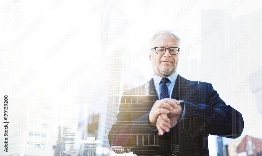 Fototapeta premium senior businessman checking time on his wristwatch