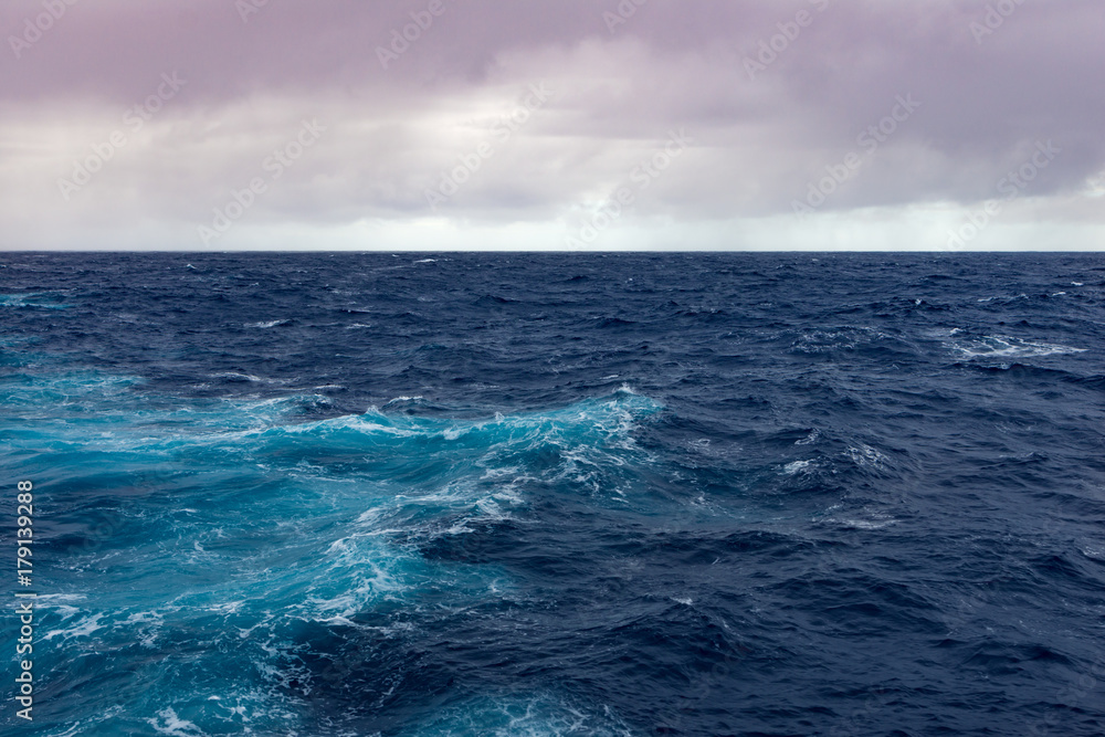 Clouds, waves and ship trace in Pacific