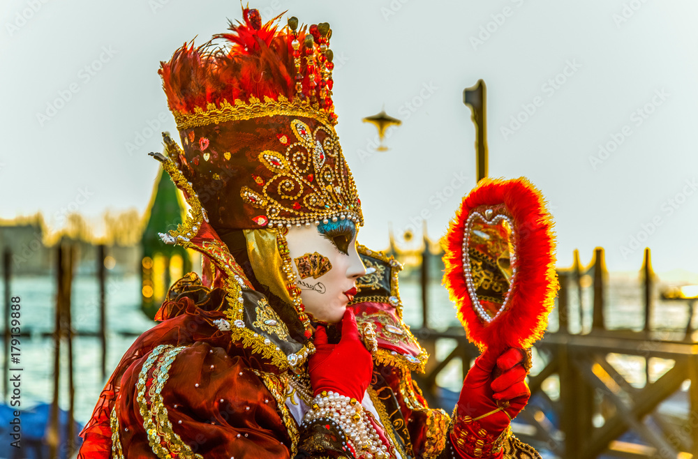 Naklejka premium people in masks and costumes on Venetian carnival