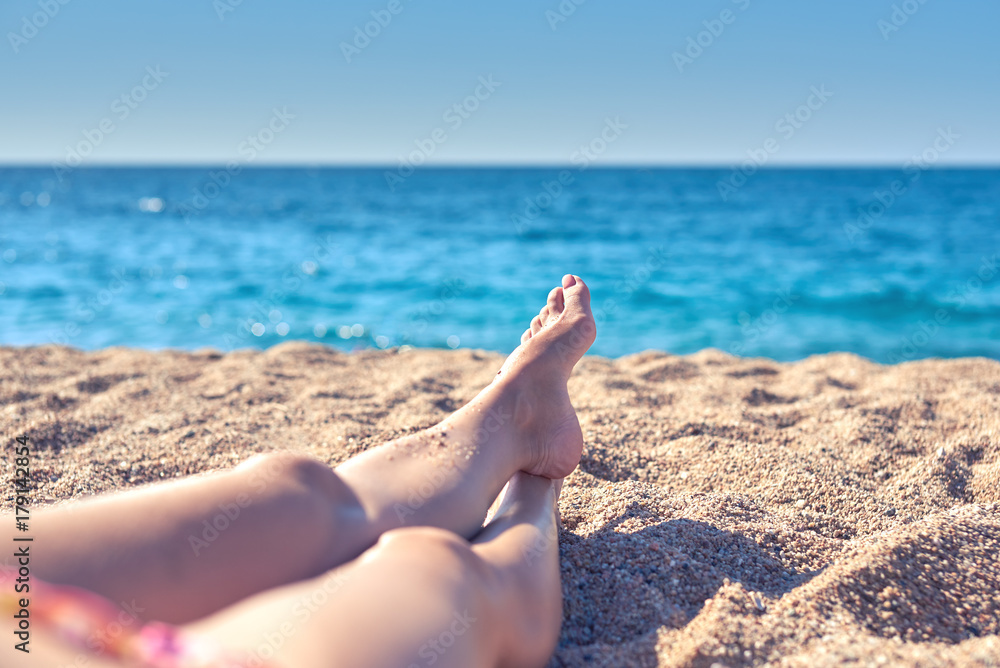 Woman relaxing on the beach.