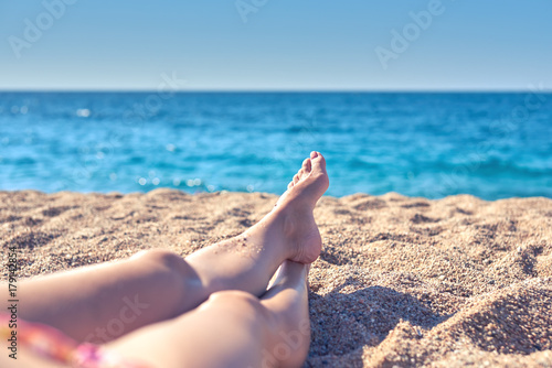 Photography Woman relaxing on the beach.
