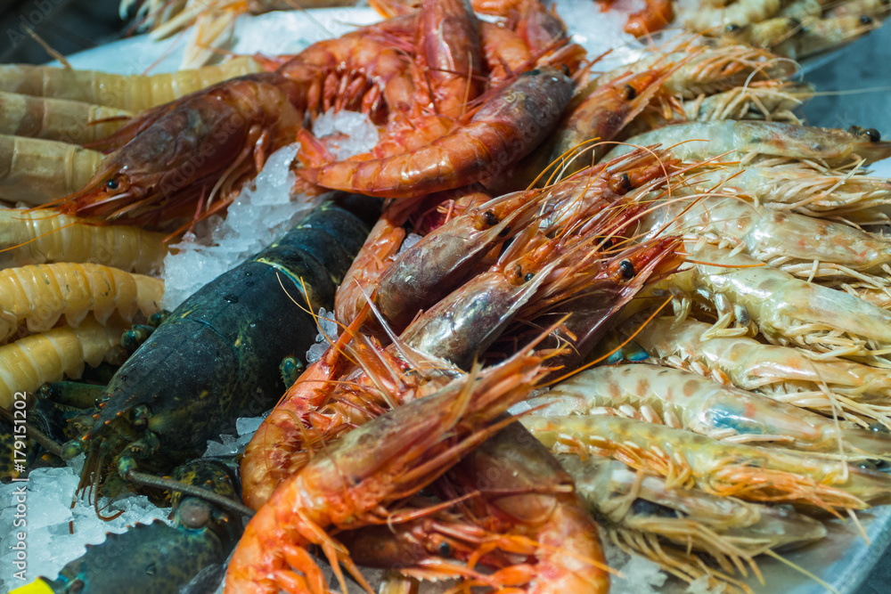 Fresh shrimps and lobsters on ice Fresh shrimps and lobsters on ice