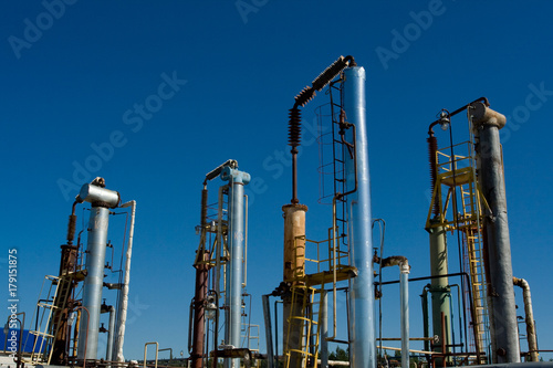 Factory chimneys on the sky background