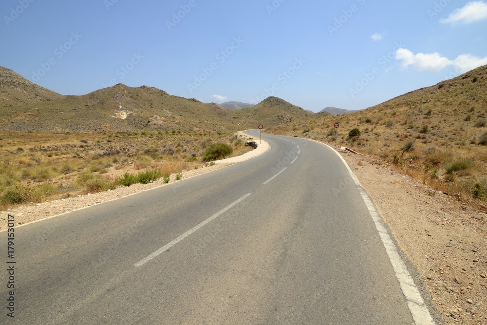 Emblematic and idyllic road in the cabo de gata-níjar natural park, Almeria, Andalusia, Spain Emblematic and idyllic road in the cabo de gata-níjar natural park, Almeria, Andalusia, Spain