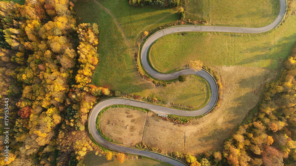 Road in autumn scenery - aerial shot