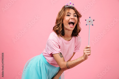 Slika na platnu Portrait of a smiling cheery girl dressed in fairy costume